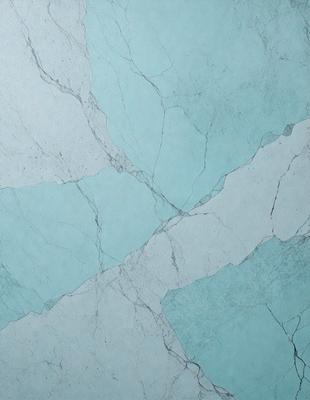 The primary subject of the image is a blue marble wall with a pattern of white and blue stripes. The setting is a bathroom, and the visual style is a photo. The dominant colors are blue and white, creating a calm and soothing atmosphere.