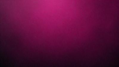 The primary subject of the image is a close-up of a pink wall. The setting is a room with a pink background. The visual style is a photo, and the dominant colors are pink and purple. The overall atmosphere is warm and inviting.