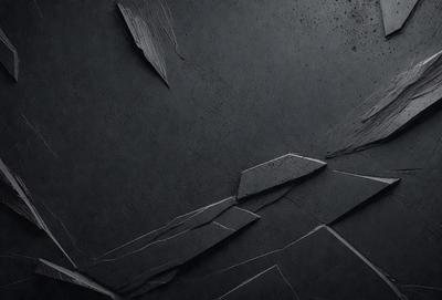 The primary subject of the image is a black and white photo of a wall. The setting is a dark room, and the visual style is a close-up of the wall. The colors and mood of the image are predominantly black and white, creating a moody and dramatic atmosphere.