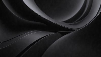 The primary subject of the image is a black and white photo of a spiral or swirl pattern. The setting is a dark background, which contrasts with the spiral pattern. The visual style is a black and white photo, giving it a classic and timeless appearance. The colors and mood of the image are predominantly dark, with the spiral pattern being the main focus and source of visual interest.