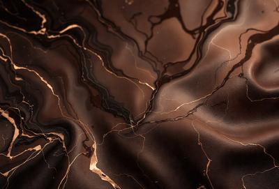 The primary subject of the image is a close-up of a marbled surface, which appears to be a piece of chocolate. The setting is a dark background, which contrasts with the rich brown color of the chocolate. The visual style is a close-up, focusing on the intricate patterns and textures of the marbled surface. The colors and mood of the image are predominantly dark and moody, with the chocolate's rich brown hue creating a sense of depth and complexity.