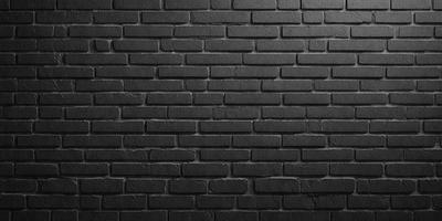 The primary subject of the image is a black brick wall. The setting is a dark room, and the visual style is a close-up of the brick wall. The colors and mood of the image are predominantly dark, with the black brick wall being the main focus.