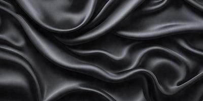 The primary subject of the image is a close-up of a black fabric, possibly a piece of clothing or a curtain. The setting is a dark background, which emphasizes the fabric's texture and pattern. The visual style appears to be a photo, as it captures the details of the fabric. The colors and mood of the image are predominantly dark, with the black fabric being the main focus.
