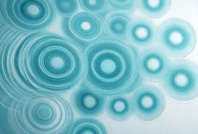 The primary subject of the image is a blue and white pattern, which is a digital artwork. The setting is a blue background, and the visual style is digital art. The dominant colors are blue and white, creating a calm and soothing atmosphere.