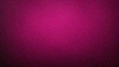 The primary subject of the image is a large, pink wall. The setting is a room with a pink background, and the visual style is a close-up of the wall. The dominant colors are pink, and the overall atmosphere is warm and inviting.