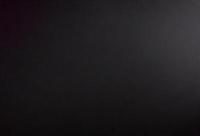 The primary subject of the image is a black background. The setting is a dark, empty space with no visible objects or details. The visual style is a simple, monochromatic image with no additional elements or textures. The colors and mood are predominantly dark and moody, creating a sense of mystery or drama.