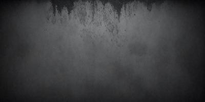 The primary subject of the image is a gray wall with a few blue dots on it. The setting is a room with a gray background. The visual style is a close-up of the gray wall, which gives it a textured appearance. The colors and mood of the image are predominantly gray and somewhat moody.