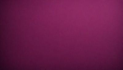 The primary subject of the image is a large, purple wall. The setting is a room with a pink background. The visual style is a close-up of the purple wall, which gives a sense of depth and texture. The colors and mood of the image are predominantly purple, creating a calm and serene atmosphere.