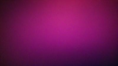 The primary subject of the image is a purple wall. The setting is a room with a purple background. The visual style is a close-up of the purple wall, which gives a sense of depth and texture. The colors and mood of the image are predominantly purple, creating a calm and serene atmosphere.