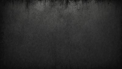The primary subject of the image is a black and white photo of a wall. The setting is a room with a black and white background. The visual style is a black and white photo, giving it a classic and timeless appearance. The colors and mood of the image are predominantly black and white, creating a sense of depth and contrast.