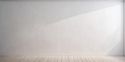 The primary subject of the image is a white wall with a shadow cast on it. The setting is a room with a wooden floor. The visual style is a photo, and the colors and mood are predominantly white, giving the image a clean and minimalist appearance.