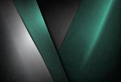 The primary subject of the image is a close-up of a green, blue, and black striped material. The setting is a dark room, and the visual style appears to be a photo. The colors and mood of the image are predominantly dark and moody, with the green, blue, and black stripes creating a striking contrast against the dark background.