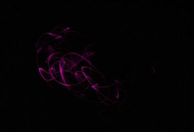 The primary subject of the image is a purple, pink, and white swirl pattern. The setting is a dark background, which contrasts with the swirl pattern. The visual style is a digital art or illustration, as the swirl pattern appears to be a digital creation. The colors and mood of the image are predominantly purple and pink, creating a sense of calmness and tranquility.