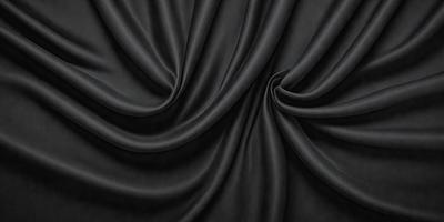 The primary subject of the image is a black curtain. The setting is a dark room, and the visual style is a close-up of the curtain. The curtain appears to be made of fabric, and the overall atmosphere is dramatic and mysterious.
