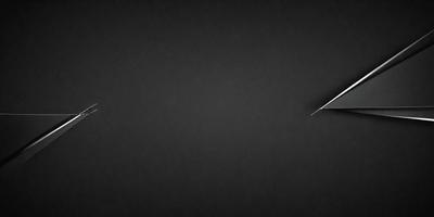 The primary subject of the image is a pair of scissors. The setting is a black background, which creates a contrast with the scissors. The visual style is a close-up of the scissors, emphasizing their details. The colors and mood of the image are predominantly black, giving it a bold and striking appearance.
