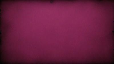 The primary subject of the image is a large, purple wall. The setting is a room with a pink background. The visual style is a close-up of the purple wall, which gives a sense of depth and texture. The colors and mood of the image are predominantly purple, creating a calm and serene atmosphere.