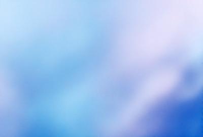 The primary subject of the image is a blue sky with clouds. The setting is a cloudy sky, and the visual style is a photo. The dominant colors are blue and white, creating a calm and serene atmosphere.