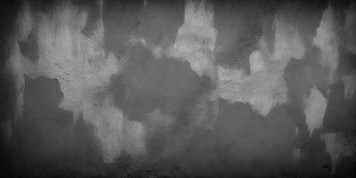 The primary subject of the image is a gray wall with a pattern of white and gray paint. The setting is a room with a gray background. The visual style is a combination of photo and digital art, creating a unique and artistic appearance. The dominant colors are gray and white, giving the image a calm and neutral atmosphere.