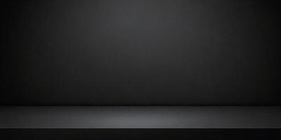 The primary subject of the image is a black wall. The setting is a dark room, and the visual style is a black and white photo. The colors and mood of the image are predominantly dark and moody, with a sense of mystery and simplicity.