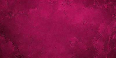 The primary subject of the image is a close-up of a red wall with a purple tint. The setting is a room with a red wall, and the visual style is a close-up of the wall. The dominant colors are red and purple, creating a warm and vibrant atmosphere.