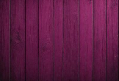 Purple wood paneling on a wall.