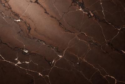 The primary subject of the image is a marble wall with a brown and white pattern. The setting is a room with a brown and white marble wall as the main focus. The visual style is a close-up of the marble wall, showcasing its intricate pattern. The colors and mood of the image are warm and earthy, with the brown and white marble creating a natural and elegant atmosphere.