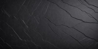 The primary subject of the image is a close-up of a black surface, possibly a wall or a piece of art. The setting appears to be a dark room, with the black surface being the main focus. The visual style of the image is a close-up, which emphasizes the details of the black surface. The colors and mood of the image are predominantly dark and moody, creating a sense of mystery or intrigue.