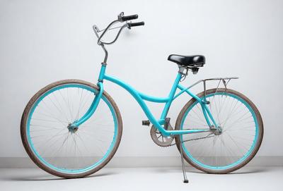 The primary subject of the image is a blue bicycle with a black seat. The bicycle is parked against a white wall, which serves as the setting and background of the scene. The visual style of the image is a photo, capturing the details of the bicycle and its surroundings. The colors in the image are predominantly blue and white, creating a calm and serene atmosphere.