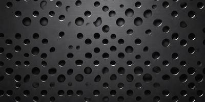 The primary subject of the image is a black surface with numerous holes in it. The setting appears to be a dark room, and the visual style is a close-up of the black surface. The dominant colors are black and white, and the overall atmosphere is mysterious and intriguing.