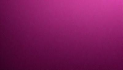 The primary subject of the image is a large, pink wall. The setting is a room with a pink background, and the visual style is a close-up of the wall. The dominant colors in the image are pink, and the overall atmosphere is warm and inviting.