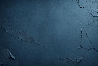 The primary subject of the image is a blue wall with a cracked and peeling texture. The setting is a room with a blue background. The visual style is a close-up of the blue wall, showcasing its unique texture. The colors and mood of the image are predominantly blue, creating a calm and serene atmosphere.
