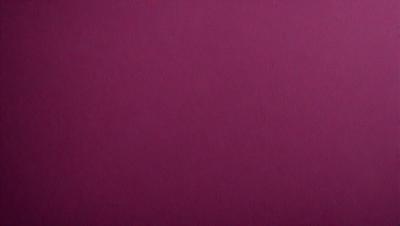 The primary subject of the image is a close-up of a red surface, which appears to be a piece of fabric or a wall. The setting is a room with a red background, and the visual style is a close-up of the red surface. The colors and mood of the image are predominantly red, creating a warm and vibrant atmosphere.