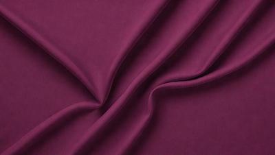 The primary subject of the image is a purple fabric, which is the main object, scene, or focus of the image. The setting or background of the image is a purple sheet, and the visual style appears to be a photo. The colors and mood of the image are predominantly purple, creating a calm and soothing atmosphere.