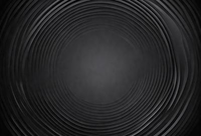 The primary subject of the image is a black and white photo of a circular pattern. The setting is a black background, which creates a striking contrast with the circular pattern. The visual style is a close-up of the circular pattern, emphasizing its details. The colors and mood of the image are predominantly black and white, giving it a classic and timeless feel.