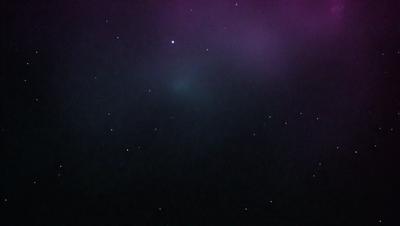 The primary subject of the image is a night sky filled with stars. The setting is a dark, star-filled sky, and the visual style is a photo. The colors and mood of the image are predominantly dark and serene, with the stars providing a sense of depth and beauty.