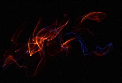 The primary subject of the image is a blue and orange flame, which appears to be a digital art or illustration. The setting is a dark background, and the visual style gives the impression of a painting or a graphic design. The dominant colors in the image are blue and orange, creating a vibrant and lively atmosphere.