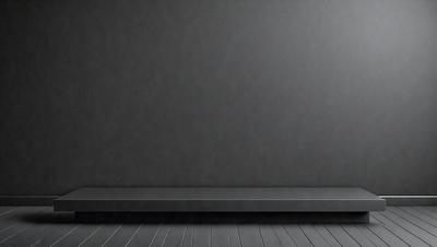 The primary subject of the image is a large, empty room with a gray wall. The setting is a room with a gray wall, and the visual style is a photo. The room appears to be empty and has a somewhat dark and moody atmosphere.