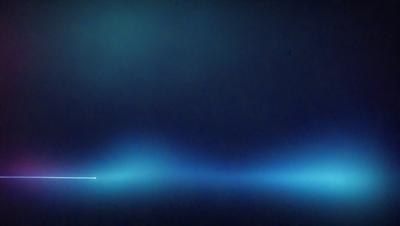 The primary subject of the image is a blue sky with a few clouds. The setting is a dark, foggy night, creating a moody atmosphere. The visual style is a photo, capturing the night sky with a sense of depth and contrast. The colors and mood are predominantly dark and mysterious, with the blue sky and clouds providing a sense of tranquility and calmness.