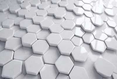 The primary subject of the image is a white tile floor with a pattern of hexagonal shapes. The setting is a room with a white tile wall, and the visual style is a close-up of the floor tiles. The colors and mood of the image are predominantly white, giving it a clean and minimalist appearance.