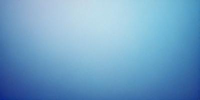 The primary subject of the image is a large, empty blue sky. The setting is a vast, open space with no visible landmarks or objects. The visual style is a realistic representation of the sky, with no indication of digital art or illustration. The colors and mood of the image are predominantly blue, creating a calm and serene atmosphere.