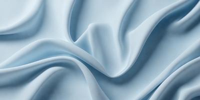 The primary subject of the image is a blue fabric, which appears to be a piece of cloth or a sheet. The setting is a white background, which provides a clean and uncluttered environment for the fabric. The visual style of the image is a close-up of the fabric, showcasing its texture and details. The colors and mood of the image are predominantly blue, creating a calm and soothing atmosphere.