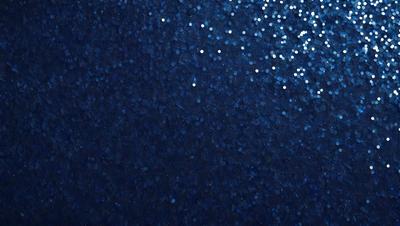 The primary subject of the image is a blue background with a pattern of white stars. The setting appears to be a night sky, and the visual style is a combination of a photo and digital art. The dominant colors are blue and white, creating a serene and peaceful atmosphere.