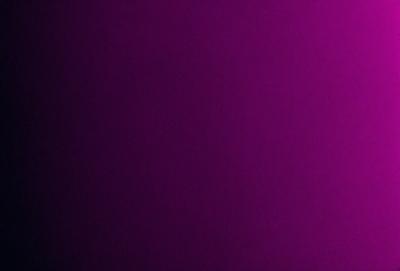 The primary subject of the image is a purple wall. The setting is a dark room with a purple background. The visual style is a close-up of the purple wall, which gives a sense of depth and texture. The colors and mood of the image are predominantly purple, creating a calm and serene atmosphere.