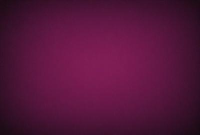 The primary subject of the image is a purple background. The setting is a dark, purple room with a pinkish hue. The visual style is a close-up of the purple background, which gives the image a moody and dramatic appearance. The colors and mood of the image are predominantly purple and pink, creating a sense of depth and intensity.