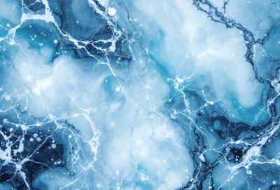 The primary subject of the image is a blue and white marbled surface, which appears to be a wall or a piece of art. The setting is a room with a blue and white marbled wall, and the visual style is a close-up of the marbled surface. The colors and mood of the image are predominantly blue and white, creating a calm and serene atmosphere.