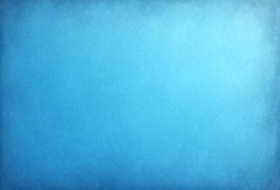 The primary subject of the image is a large, empty blue sky. The setting is a vast, open space with no visible landmarks or objects. The visual style is a natural, outdoor environment. The colors and mood are predominantly blue, creating a calm and serene atmosphere.