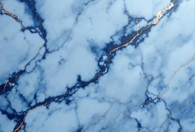 The primary subject of the image is a blue marble wall with a gold stripe. The setting is a room with a blue marble countertop. The visual style is a photo of the marble wall and countertop. The dominant colors are blue and gold, creating a calm and sophisticated atmosphere.