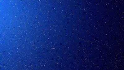 The primary subject of the image is a blue sky filled with stars. The setting is a dark blue background, which contrasts with the bright stars. The visual style is a photo of the night sky, capturing the beauty of the stars. The colors and mood of the image are serene and peaceful, as the stars create a sense of wonder and tranquility.