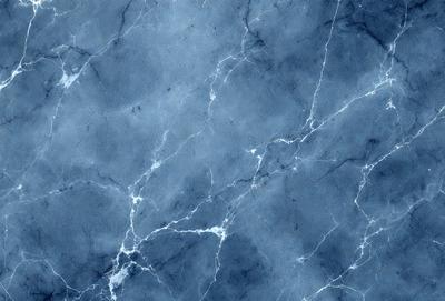 The primary subject of the image is a blue marble wall with a pattern of white and blue veins. The setting is a room with a blue marble wall, and the visual style is a close-up of the marble wall. The colors and mood of the image are predominantly blue, with a touch of white and blue from the veins, creating a serene and calming atmosphere.