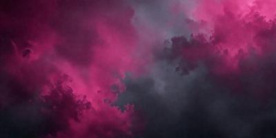The primary subject of the image is a cloudy sky with a pinkish hue. The setting is a cloudy day, and the visual style appears to be a photo. The dominant colors in the image are pink and purple, creating a moody and atmospheric scene.
